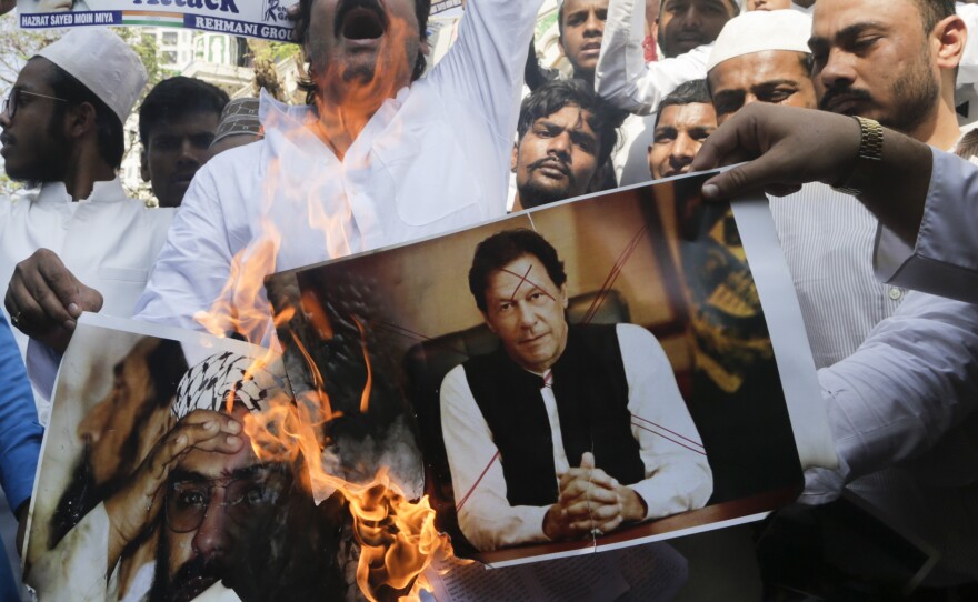 Indian protesters in Mumbai burn posters of Pakistan's Prime Minister Imran Khan during a demonstration against the Feb. 14 attack that killed more than 40 Indian policemen in the Kashmir region.