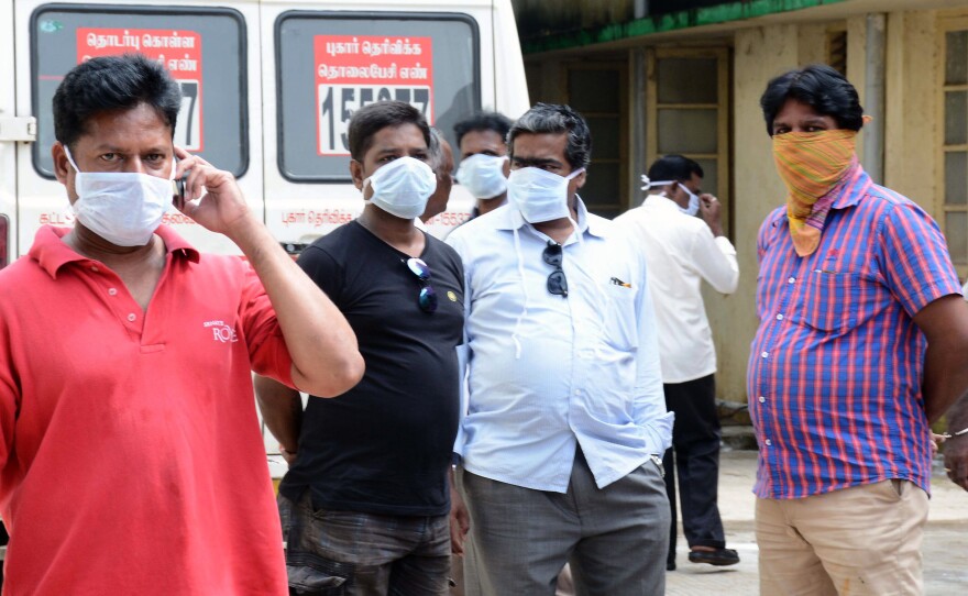Relatives gather outside Chennai's Madras Institute of Orthopaedics and Traumatology hospital on Friday after their family members reportedly died after a power outage caused ventilators to fail.