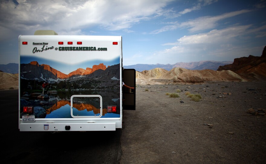 A motor home parked in the lot of Zabriskie Point. The official world record high of 134 degrees was set 100 years ago in Furnace Creek.