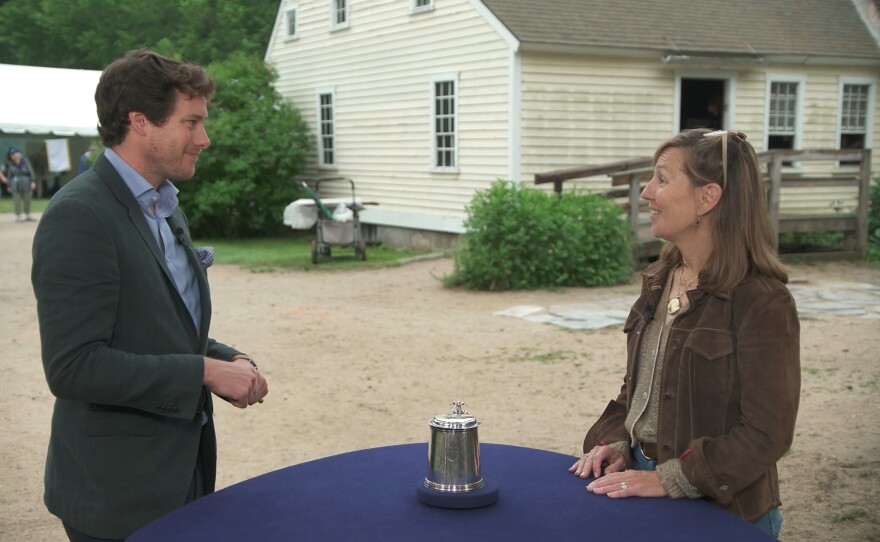 David Walker (left) appraises a David Jesse silver tankard, ca. 1695, in Sturbridge, Mass. ANTIQUES ROADSHOW “Old Sturbridge Village, Hour 3” premieres Monday, February 12 at 8/7C PM on PBS.