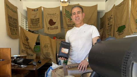 Omid Ghamami, a micro coffee roaster in Carlsbad, poses for a portrait inside his residential coffee roasting facility on March 13, 2026.