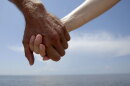 Hand-holding causes levels of the stress hormone cortisol to drop, says Matt Hertenstein, an experimental psychologist at DePauw University in Indiana. This couple joined hands while protesting offshore oil drilling in the wake of the Deepwater Horizon spill during a Hands Across the Sand event in Gulfport, Miss.