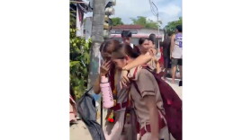 In this photo taken from a video, students react after a shooting incident at the San Jose National High School in Tacloban city, Philippines Monday, June 22, 2026. (James Daantos via AP Photo)