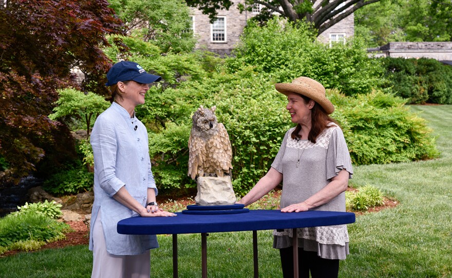 Suzanne Perrault (left) appraises an amphora porcelain owl, ca. 1920, in Nashville, Tenn.