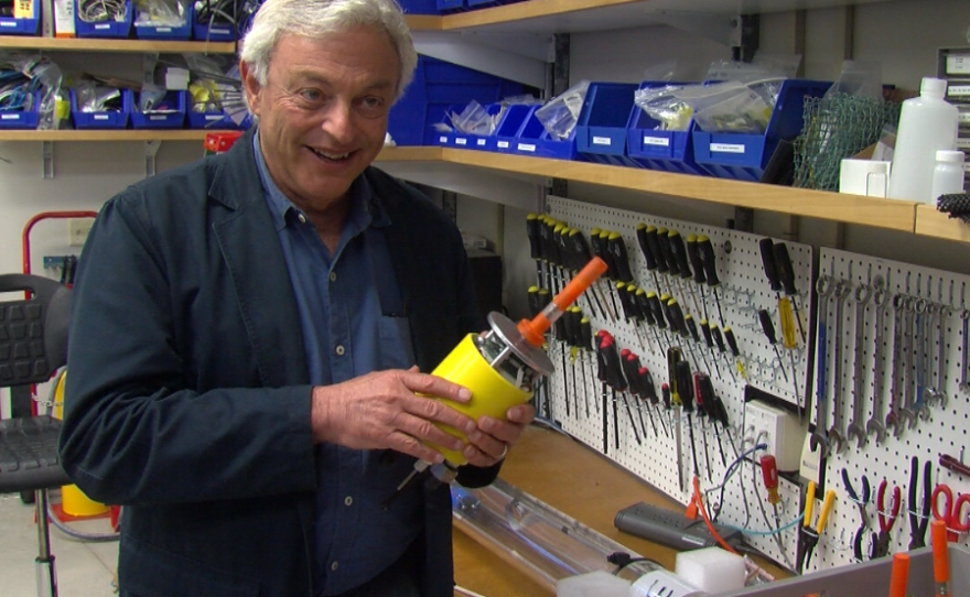 Scripps researcher Jules Jaffe holds one of the miniature underwater robots built in his lab, Jan. 20, 2017.