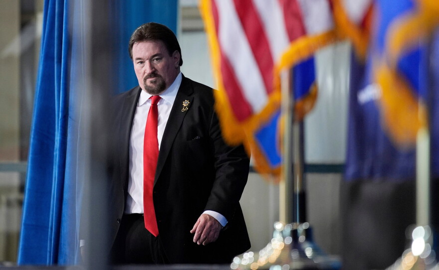 FILE - Nevada GOP chair Michael McDonald walks on stage before speaking ahead of Republican presidential candidate former President Donald Trump at a campaign event, Jan. 27, 2024, in Las Vegas.