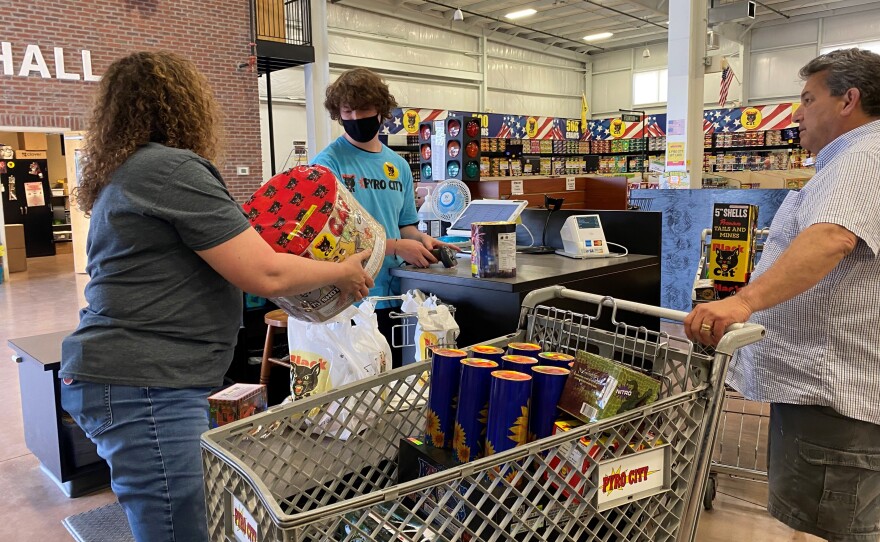 Donna Nuccio (left), store manager at the Pyro City store near Lone Jack, Mo., assists a customer.