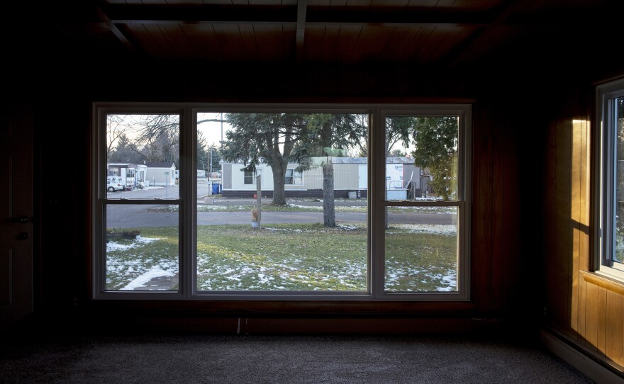Homes at Park Plaza Cooperative are seen through the window of a rental home.