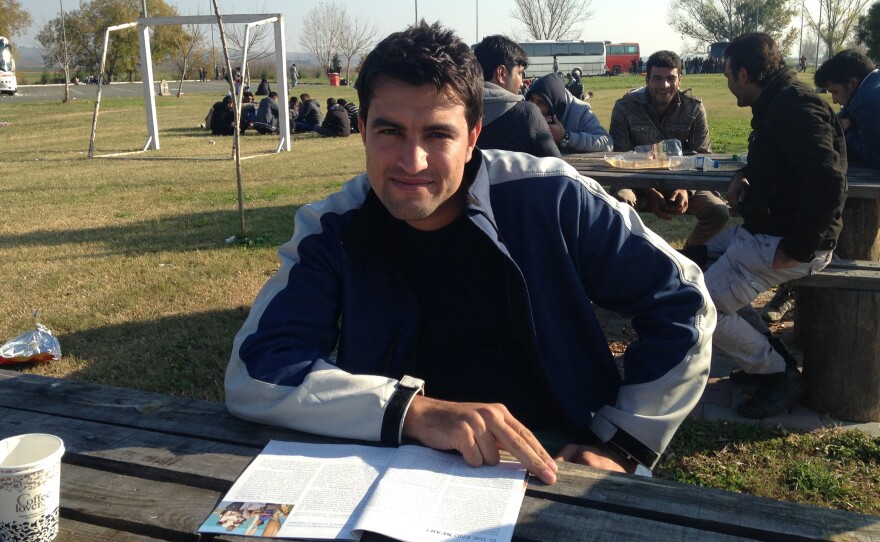 Afghan Ismail Shinwari, 22, waits at a rest stop in Greece near the border with Macedonia. Afghans are among the few migrants who are allowed into Macedonia. Shinwari, who is traveling with two Afghan friends, says he's trying to reach Belgium. "We need to go now before all the borders close," he says.
