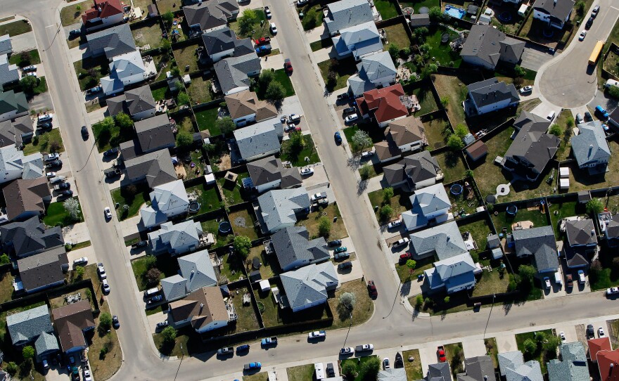 An aerial view of a new housing development near in Fort McMurray, Alberta, Canada, in June. Economic activity has slowed in the area, but local residents are optimistic that the energy sector will rebound.