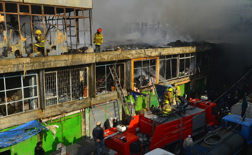 Afghan firefighters battle a 2010 market fire, which destroyed hundreds of shops. The city is bone-dry much of the year, making it a giant tinderbox.