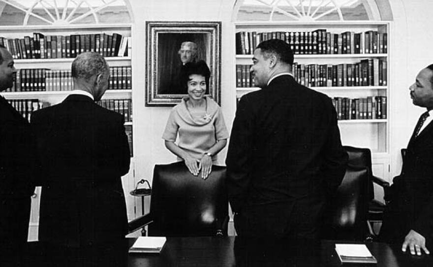 Geraldine Whittington, the first African American secretary to an American president, meets Civil Rights leaders, including Dr. Martin Luther King, Jr. (right) in the White House, 1964.
