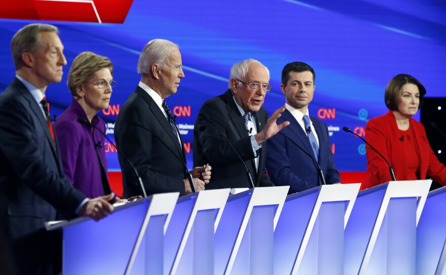 Democratic presidential candidate Sen. Bernie Sanders, center, speaks as fellow candidates businessman Tom Steyer, from left, Sen. Elizabeth Warren, former Vice President Joe Biden, former South Bend Mayor Pete Buttigieg and Sen. Amy Klobuchar, listen on Jan. 14, during a Democratic presidential debate hosted by CNN and The Des Moines Register.