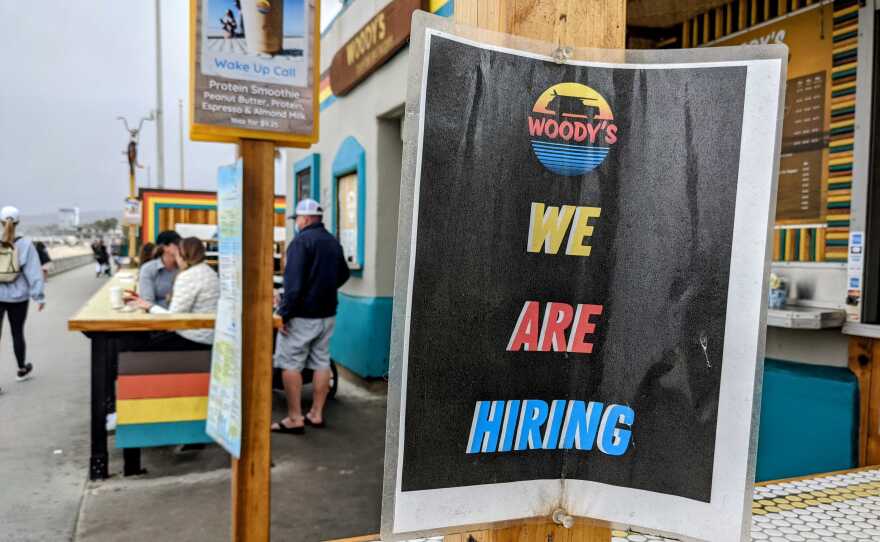 A hiring sign at Woody's in Mission Beach, May 17, 2021.