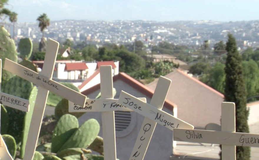 Relatives of deported immigrants placed crosses dedicated to them on a San Ysidro chain-link fence, September 20, 2015.