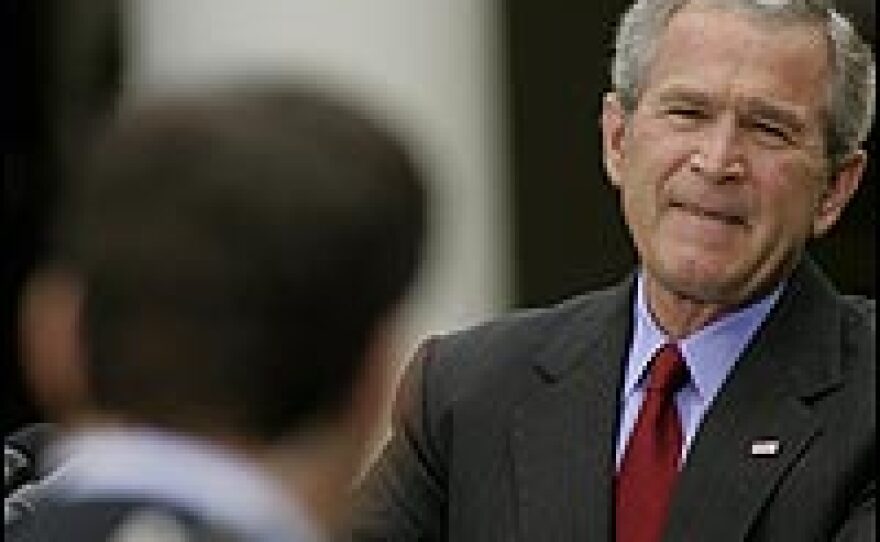 President Bush answers questions at a Rose Garden news conference Wednesday.