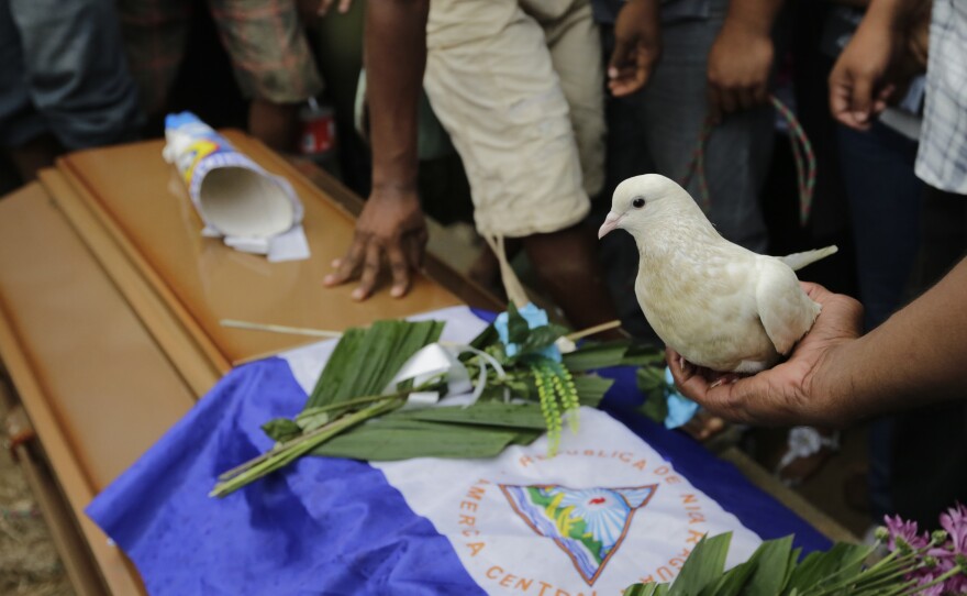 Relatives and friends attend the burial of teenager Matt Romero in Managua, Nicaragua, last September. He was shot dead during clashes between anti-government protesters and riot police and paramilitaries.