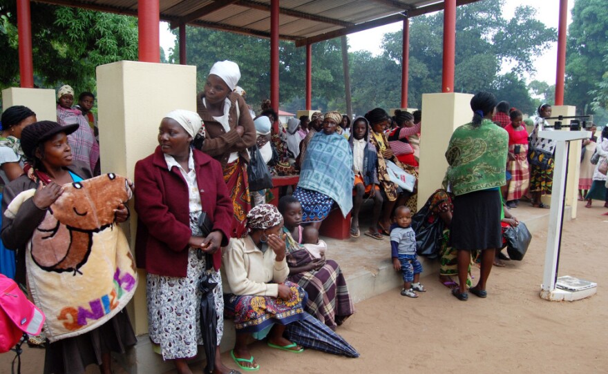 Women wait outside the maternal-child health clinic in Macia. Women who come to the clinic for prenatal care will automatically be tested for HIV.