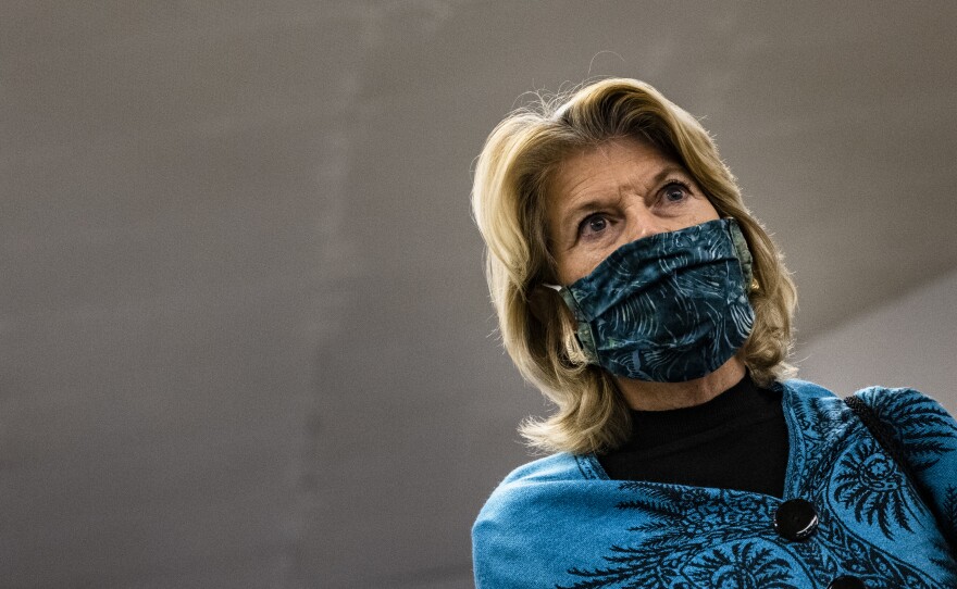 Sen. Lisa Murkowski talks to a reporter in the Senate subway at the conclusion of former President Donald Trump's second impeachment trial.