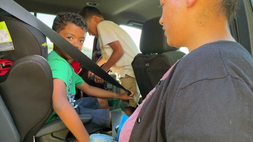 Deniece Hasson loads her three sons into the car after picking them up from Primetime, Aug. 25, 2023.