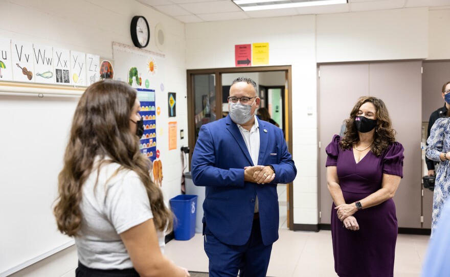 Cardona, center, and U.S Deputy Secretary of Education Cindy Marten, right, talk with staff at Locust Lane Elementary.