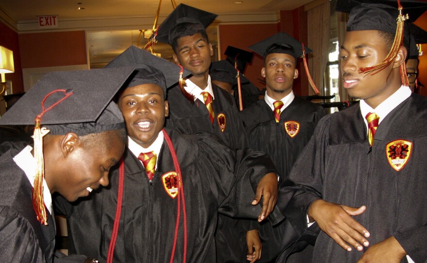 In one of the waiting rooms of the Chicago Civic Opera House, Urban Prep graduates dance and let off some steam before the school's commencement ceremony begins.