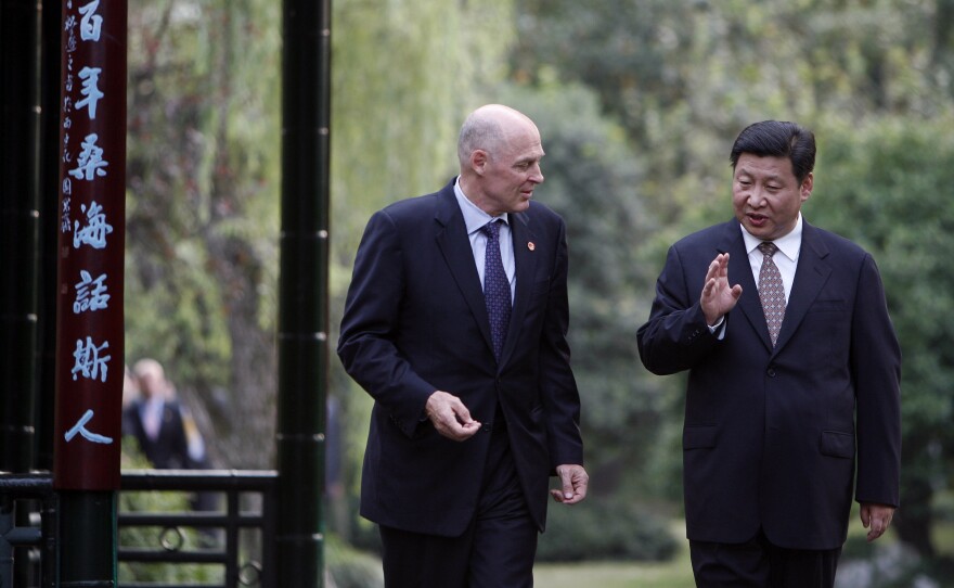 A 2006 photo of former U.S. Treasury Secretary Henry Paulson meeting with Xi Jinping in Hangzhou, China. Jinping became president of China in 2013.