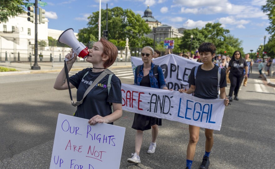 Protesters march near the U.S. Supreme Court to call for abortion rights protection on May 28 in Washington, D.C.