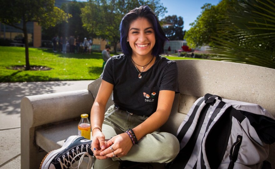 California Polytechnic State University student Analí Salazar, 22, sits outside on a bench before her welding class on Dec. 2, 2021. Salazar is a transfer student studying mechanical engineering.