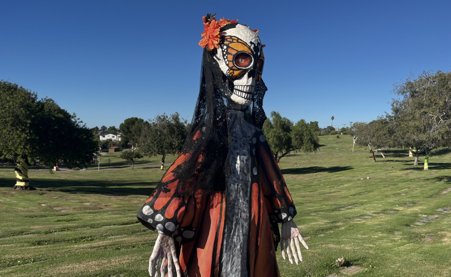 A large catrina, or elegant skeleton, stands overlooking La Vista Memorial Park, Oct. 26, 2026.