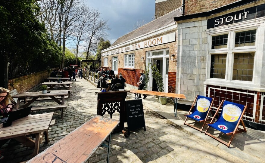 Tables begin to fill up on reopening day at the Carlton Tavern, which a developer illegally demolished in 2015 and was forced to have it rebuilt as a near-perfect replica of the century-old original.