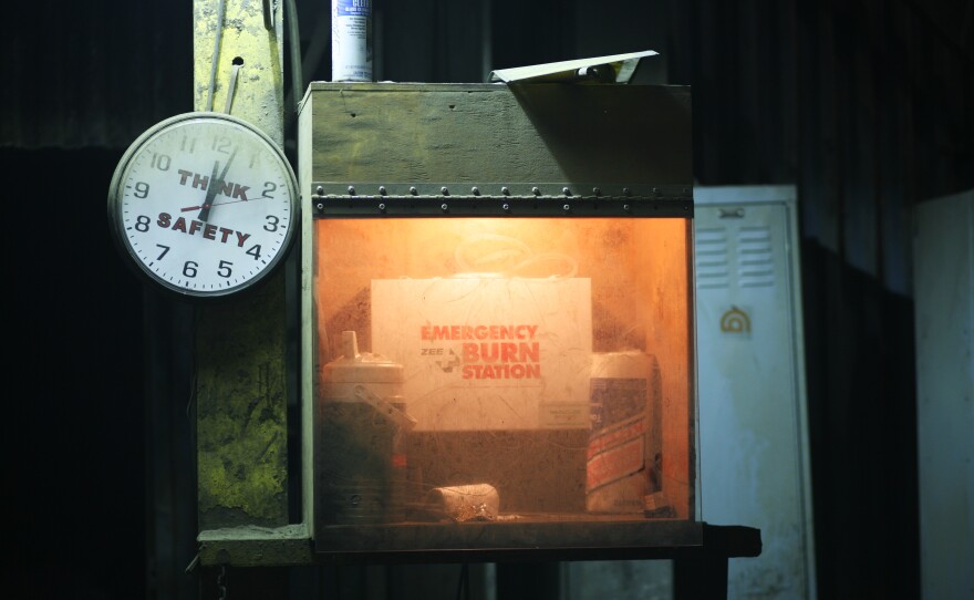 A safety station at the foundry is covered in a layer of dust from the furnace. Safety is a top priority since a small drop of molten metal can cause serious burns.