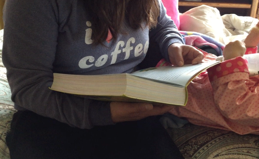 A San Diego immigrant reads to a little girl, Jan. 22, 2017.