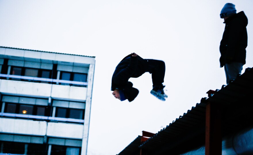 Kids play at an apartment block in Nuuk, Greenland, jumping into snowdrifts from the roof of a covered walkway. For more than 30 years, the suicide rate in Greenland has been among the highest in the world.