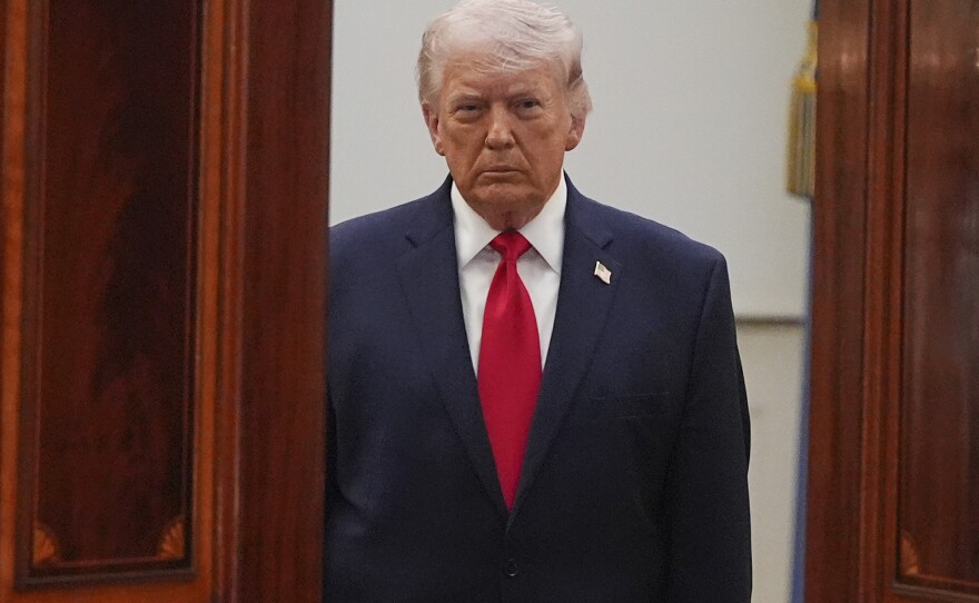 President Donald Trump arrives from the Blue Room to speak about the Iran war from the Cross Hall of the White House on April 1.