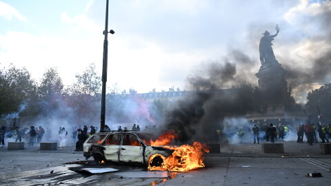 A car burns at Place de La Republique during a protest against rising living costs in Paris on Saturday.