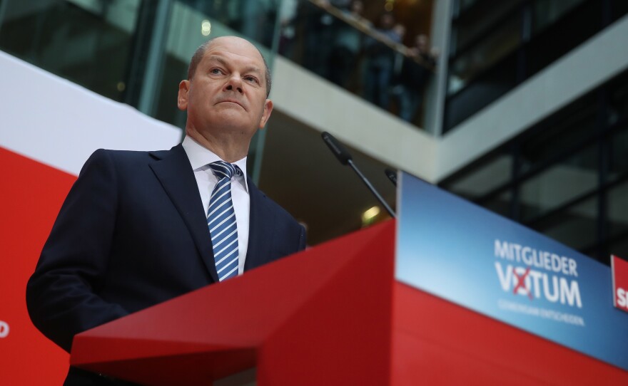 Acting chairman of the Social Democrats (SPD) Olaf Scholz announced that party members backed forming a new coalition government with Angela Merkel's Christian Democrats.