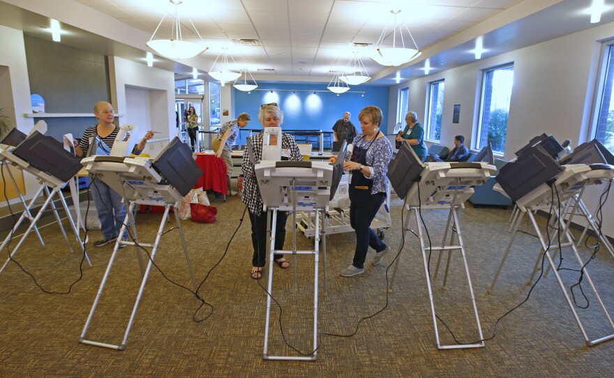 Poll workers set up voting machines for early voting in Provo, Utah in 2016.