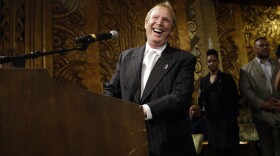 Oakland Raiders owner Mark Davis smiles as he speaks to fans during a hearing hosted by the NFL to gather comments from football fans on the possible relocation of the team in Oakland, Oct. 29, 2015.