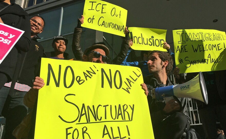 Supporters of California's sanctuary laws rally outside a San Francisco courthouse in 2017.
