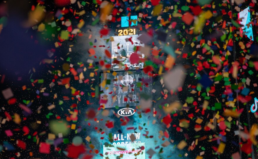 Coronavirus-related restrictions left many cities quiet during this year's New Year's Eve celebrations. New York City's Times Square was almost empty as a limited group of healthcare workers were invited to watch the ball drop in person.