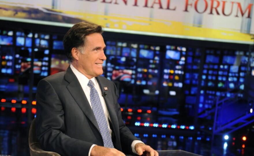 Former Massachusetts Gov. Mitt Romney appears on the Fox News program <em>Huckabee</em> on Dec. 3. The Republican presidential candidate has made a number of media appearances recently, mostly on Fox. He scarcely spoke to the media until the last week or so.