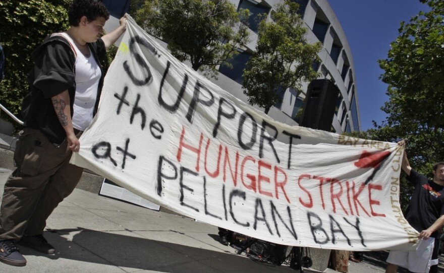 Demonstrators hold up a sign during a rally in front of the State Building in San Francisco on July 1 to support prisoners at Pelican Bay State Prison. Inmates in an isolation unit at the prison went on a hunger strike to protest conditions they describe as inhumane. The hunger strike later spread to other facilities.