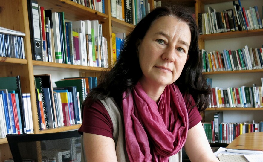 Anne Drescher, head of the archive at the local Stasi, or East German state police, displays an old diary from East German times, featuring Lenin on the cover. The archive is often used by victims and their survivors of the East German communist regime. Drescher is in favor of removing the Lenin statue.