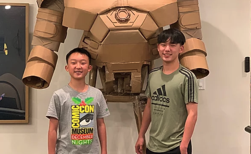 Bauer and Connor Lee with their current Cardboard Superhero project the Hulkbuster.