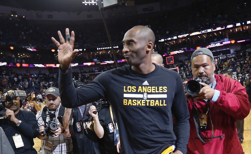 Los Angeles Lakers forward Kobe Bryant waves as he leaves the court after a game against the New Orleans Pelicans in New Orleans on April 8.