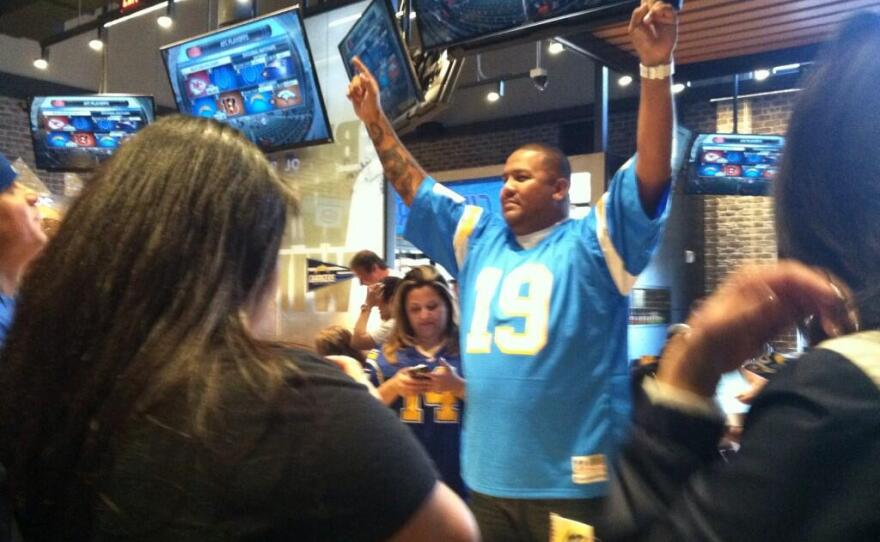 San Diego Chargers fan reacts to the Bolts' 27-10 win over the Cincinnati Bengals, Jan. 5, 2014.
