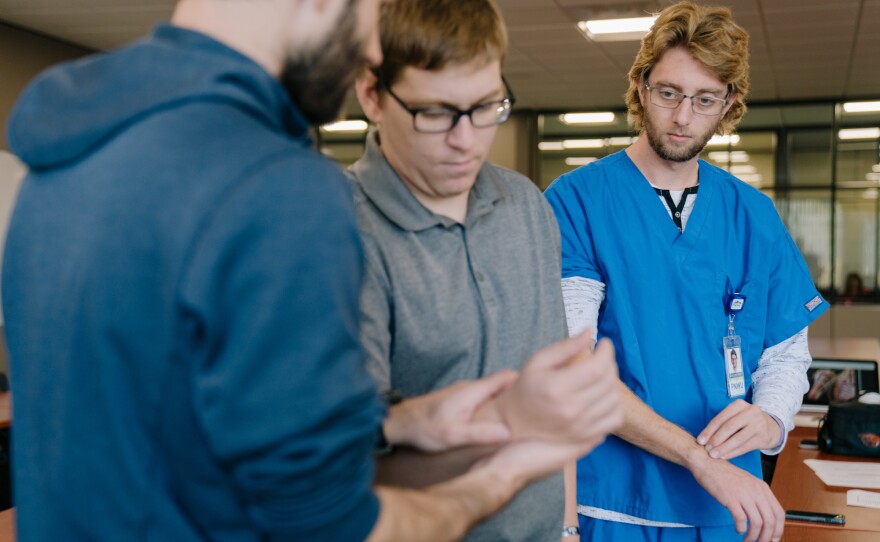 First-year medical student Matthew Braun (right) studies for an anatomy exam with classmates Jeremy Hinton (left) and Jon Hagan.