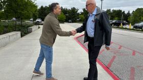 Outside a polling place in West Lafayette, Ind., Republican state Sen. Spencer Deery greets voters arriving for early voting on April 28. Deery is a Republican incumbent President Trump has targeted after he opposed the president's redistricting push in Indiana.