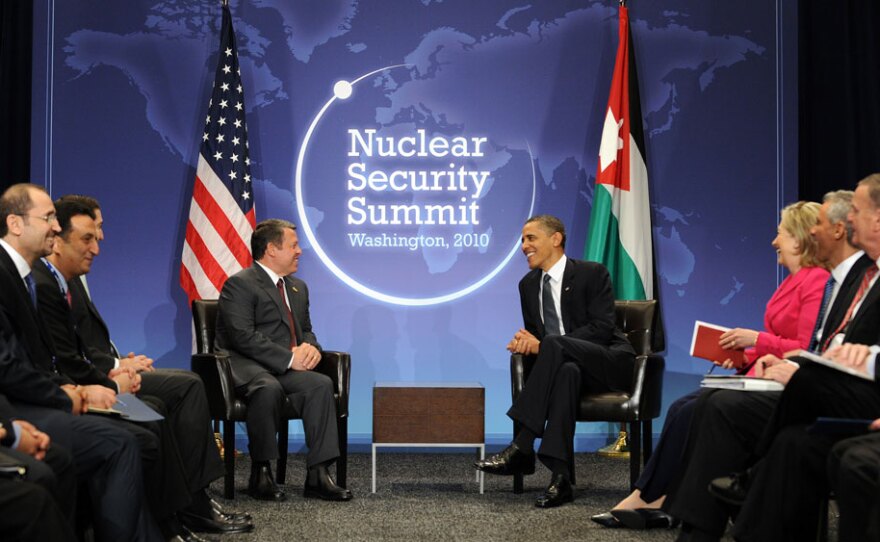President Obama meets with King Abdullah II of Jordan on the first day of the Nuclear Security Summit in Washington, D.C., as other delegates, including U.S. Secretary of State Hillary Clinton, look on.